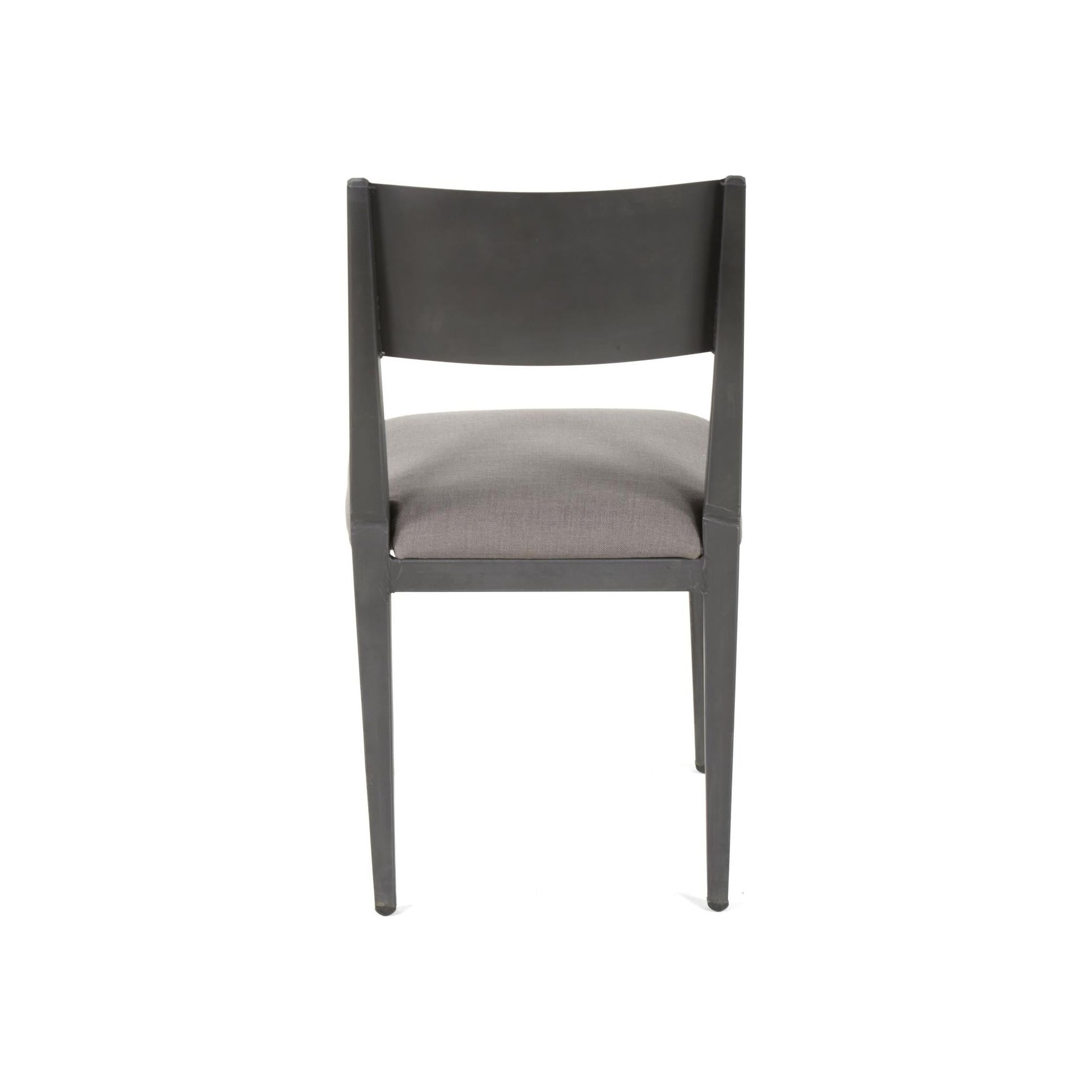 A sleek, modern chair is shown from the back. The Aubrey Metal Dining Chair features a smooth, dark-colored frame with a rectangular backrest and four slim legs. The seat is cushioned and upholstered in a light gray fabric, offering a minimalist and contemporary design. The background is completely white.