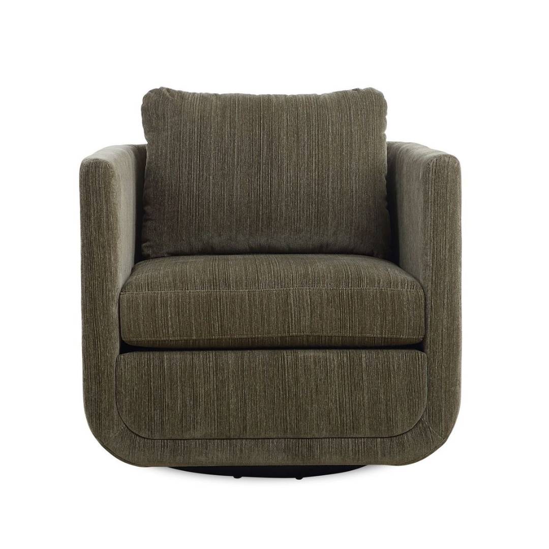 The Solana Swivel Accent Chair in green features sculptural curves, rounded arms, and a thick back cushion in textured chenille upholstery with subtle vertical lines, creating a soft look against its boxy silhouette.