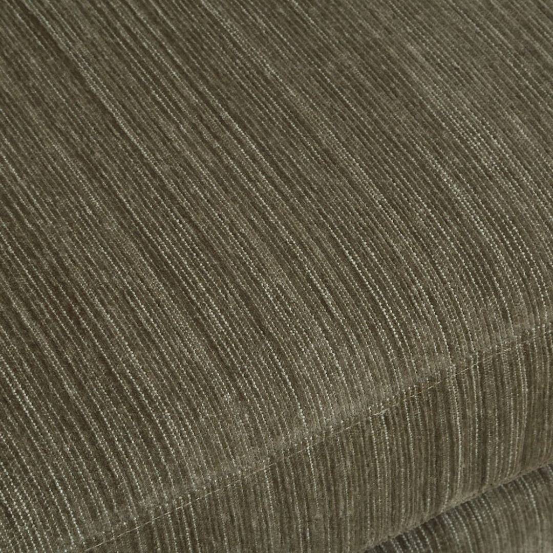 Close-up of textured brown fabric with fine light lines, showing the corner and seam of sculptural upholstery on the Solana Swivel Accent Chair, Green.