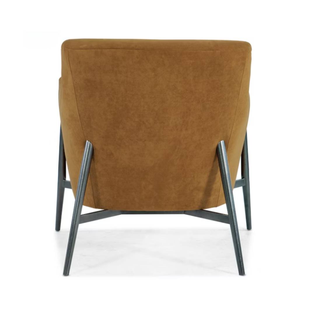 The Sienna Luxe Custom Accent Chair is shown from the back, featuring smooth light brown cognac upholstery and angled black metal legs with visible upward and outward supports. The background is plain white.