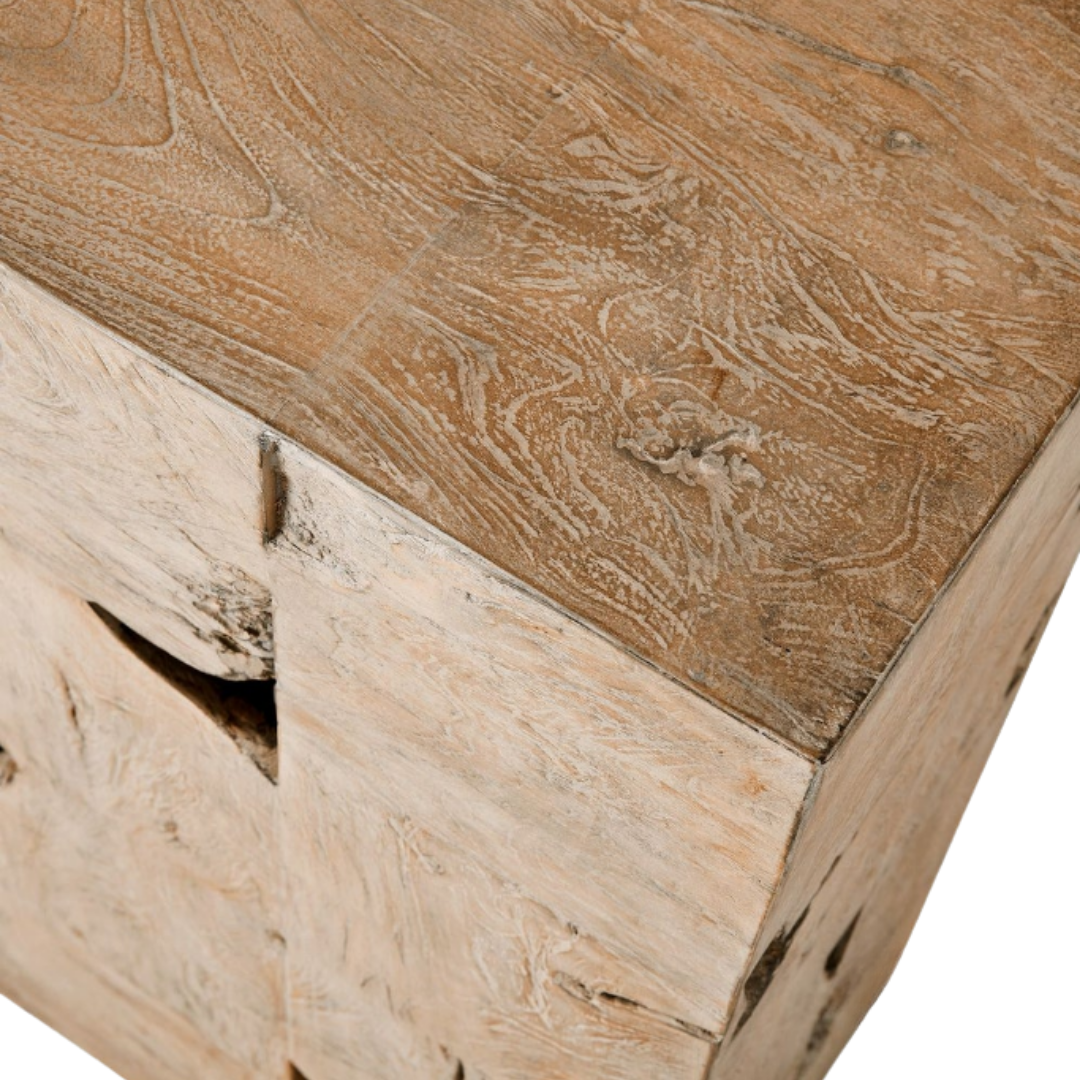 Close-up of a corner of the Bravari Organic Modern Console Table, crafted from teak wood with a textured, light surface. The natural finish highlights swirling patterns and knots for an artisanal look with a slightly weathered, whitewashed effect.
