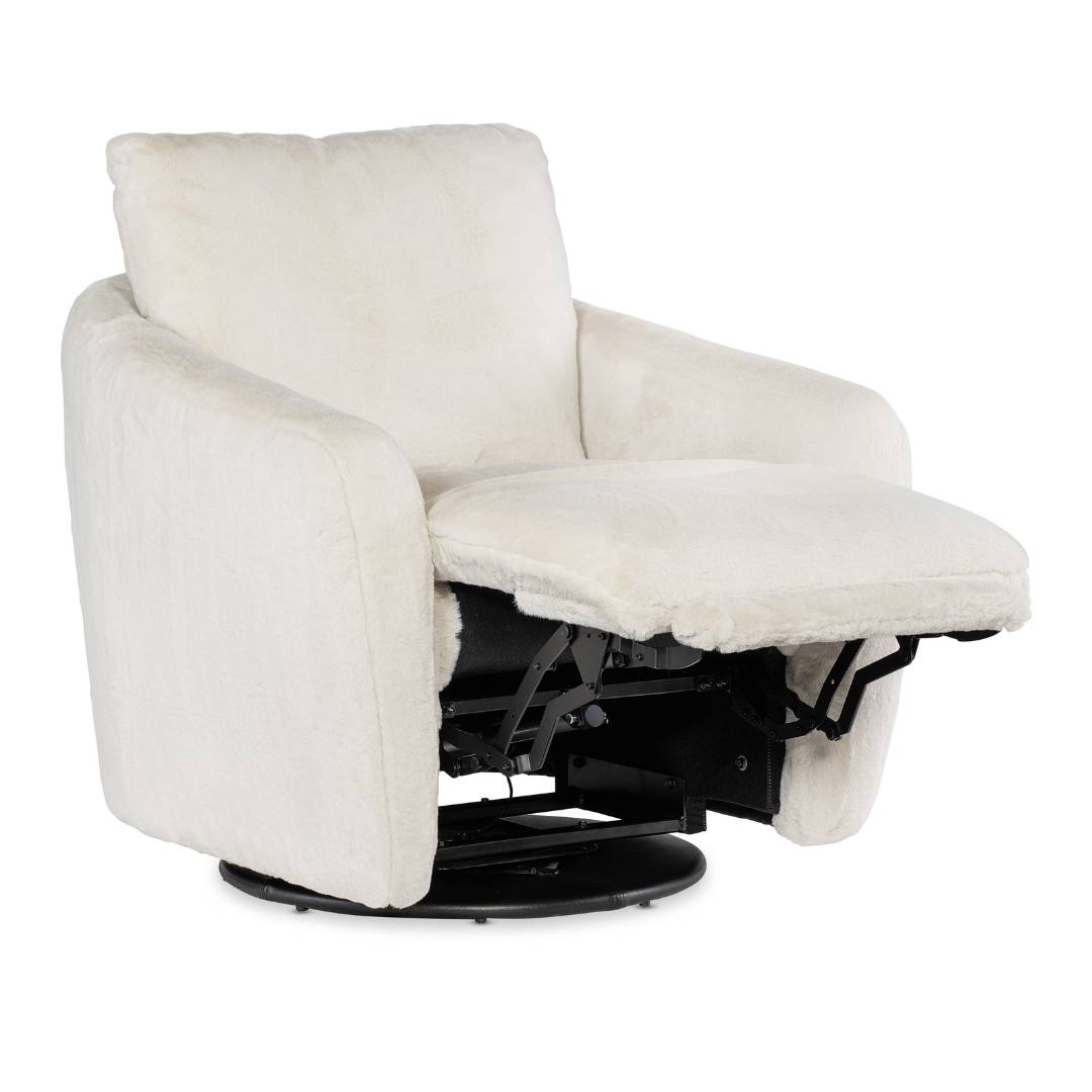 The Arista Swivel Chair with Power Footrest features soft, off-white fuzzy fabric, a power footrest with visible metal mechanisms, a round dark base for smooth swiveling, and thickly cushioned armrests and back for ultimate comfort.