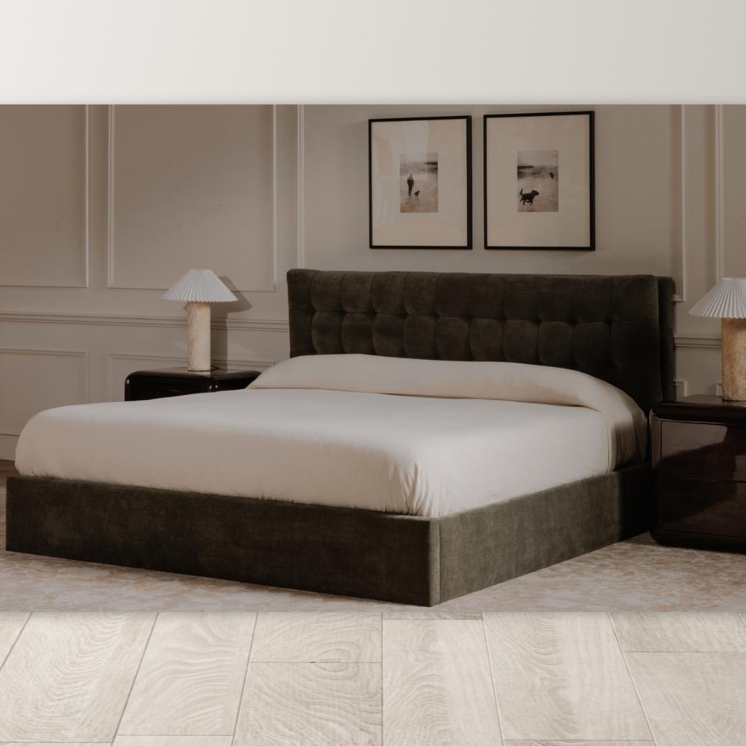 A modern bedroom highlights the Corveline Green Storage Bed with hydraulic lift storage, white bedding, and nightstands with matching lamps. Above the bed hang two framed art prints. Light walls, wood flooring, and a neutral rug complete the look.