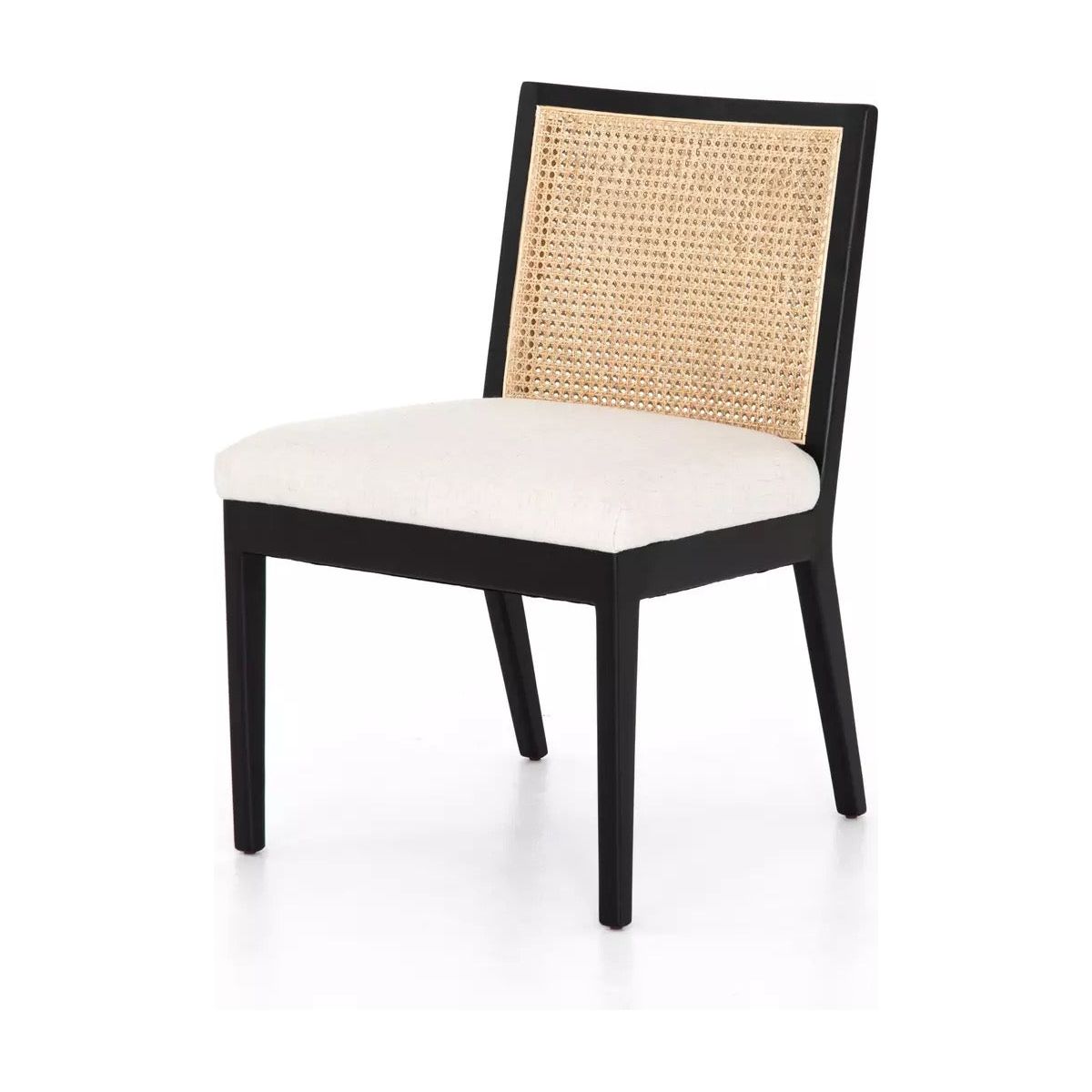 A contemporary Antonia Cane Armless Dining Chair with a black wooden frame and four legs. It features a beige upholstered seat cushion made of high-performance fabric and a backrest crafted from woven rattan, providing a stylish contrast. The durable design exudes modern elegance with a touch of natural texture against a white background.