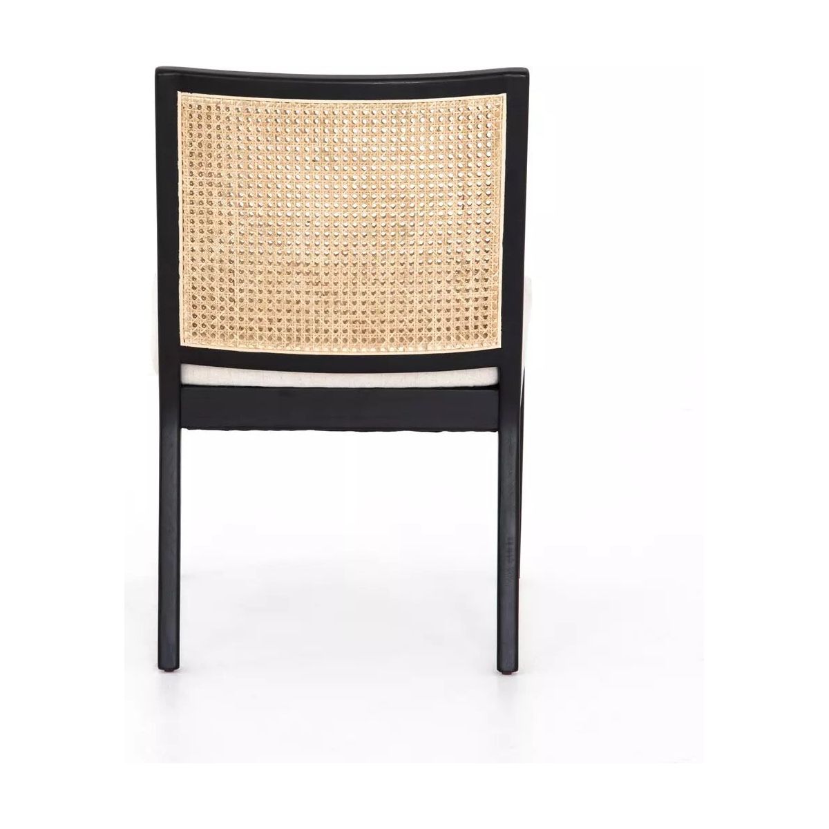 A wooden Antonia Cane Armless Dining Chair with a natural woven cane backrest. The black frame features four straight legs, supporting a cushioned seat in high-performance fabric seating. The durable dining chair is showcased on a plain white background.