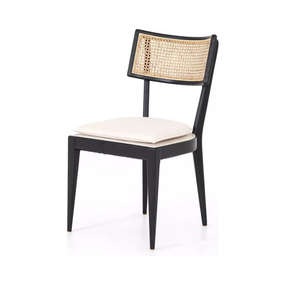 A Britt Dining Chair with an ebony-finished nettlewood frame, featuring a woven rattan backrest. The high-performance linen-blend seating adds comfort and durability. The chair has sleek, slightly tapered legs and a minimalist design, blending contemporary and natural elements seamlessly.