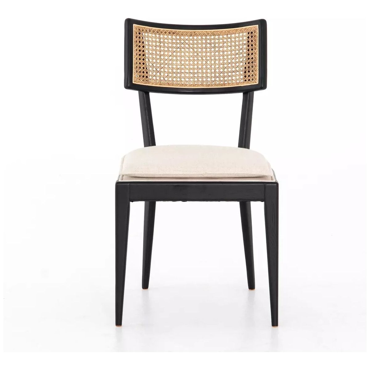 A Britt Dining Chair with a sleek black frame and tapered legs. The backrest features a woven cane design, and the padded, high-performance linen-blend seat is upholstered in light beige fabric. The chair's minimalist and elegant design stands out against the white background.