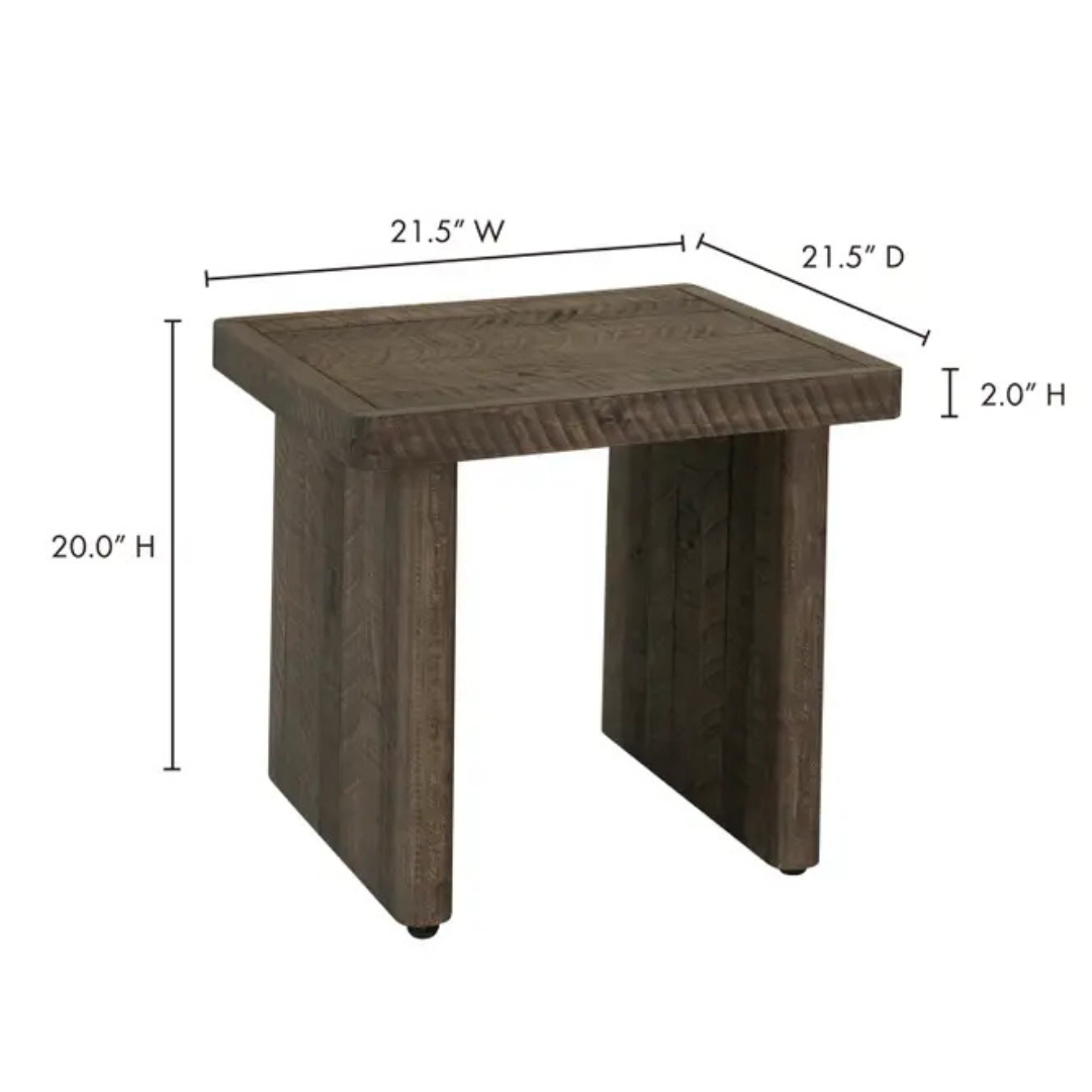 The Monte Wood Side Table has a rectangular top, thick end legs, and a rustic driftwood finish. It measures 21.5" W x 21.5" D x 20" H, with a sturdy 2" thick tabletop for added durability.