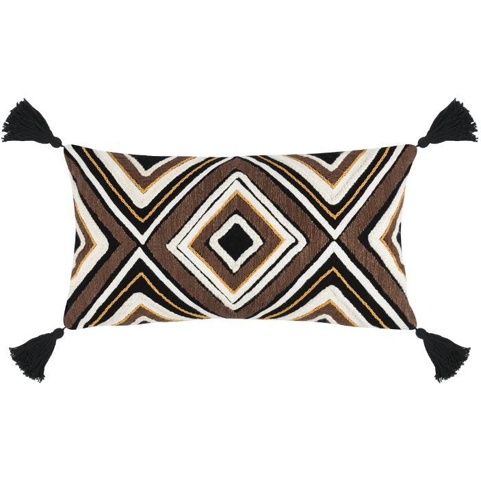 A decorative rectangular Chale Throw Pillow featuring a geometric pattern with zigzag and diamond shapes in brown, beige, and white colors, accented with black tassels on each corner.