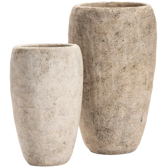 Two La Palata Vases are displayed against a white background. The taller vase is positioned slightly behind and to the right of the shorter one. Both have a textured cement appearance with a light beige and gray color scheme, ideal for rustic home decor, giving them a natural, earthy look.