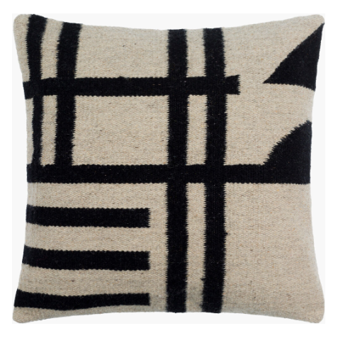 The Jeri Black & Natural Throw Pillow, sized 18x18, features a beige square design with a luxurious down insert. It boasts a textured surface with bold black geometric patterns of intersecting lines and angular shapes, creating a modern, abstract look and adding a contemporary touch.