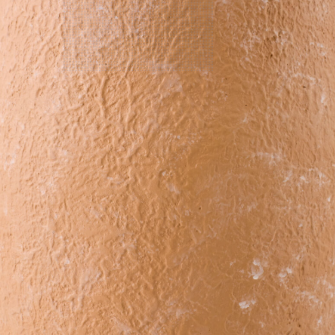 Close-up of the textured, orange-brown surface of the Solterra Grande Terracotta Vase. Subtle bumps and earthy color variations give this vase a natural, sculptural look that adds an organic accent to any entryway.
