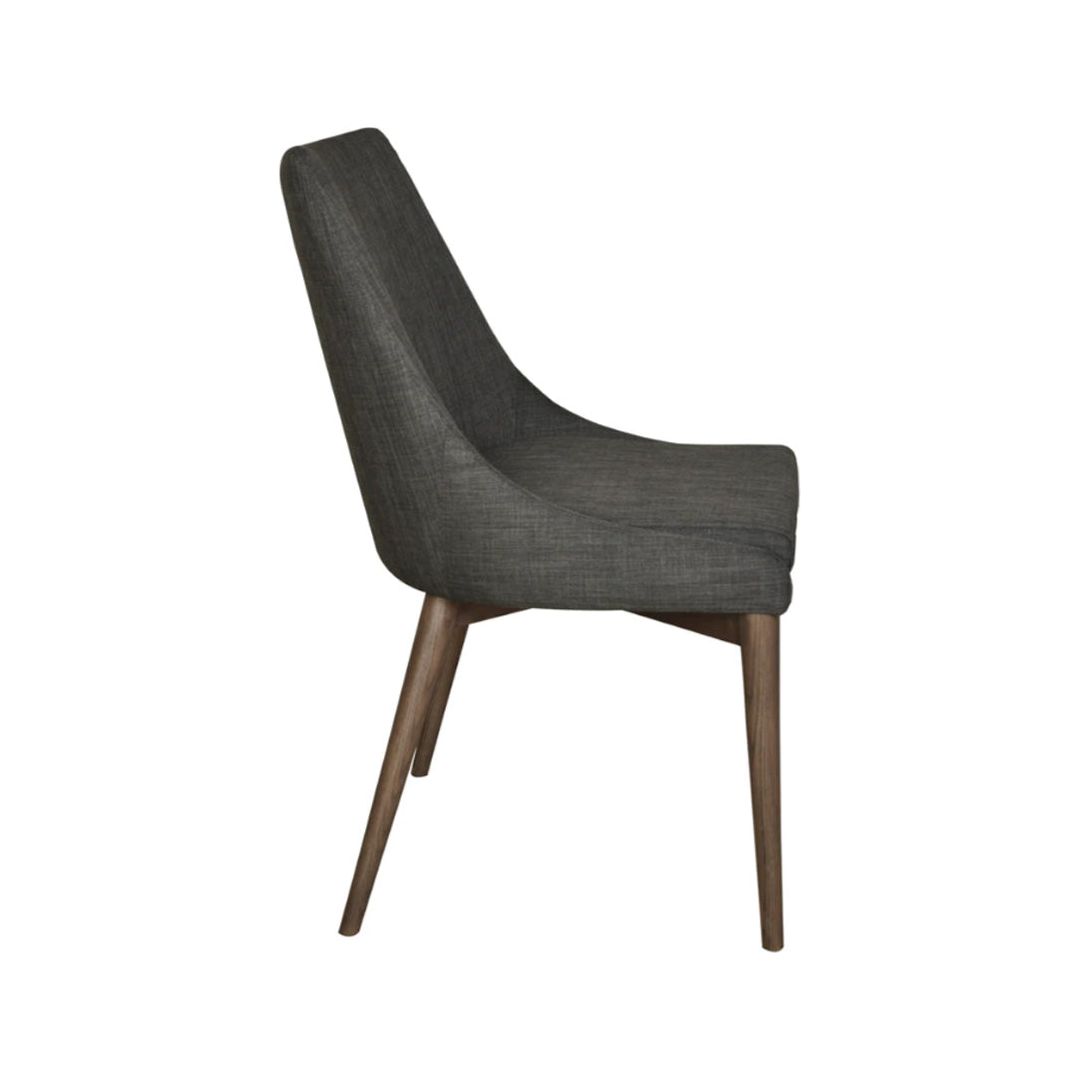 Side view of the Franny Dining Chair, Dark Gray, featuring a dark grey upholstered seat and backrest with a versatile design. The chair has wooden legs with a natural finish, slightly angled for stability. With its sleek and minimalist look, this chair is suitable for contemporary interiors.