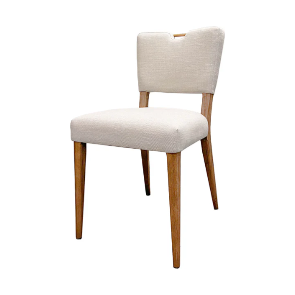 The Arden Gold Handle Dining Chair features a light beige upholstered seat and back with a top notch, set on four straight solid ash wood legs in a light brown finish, pictured against a plain white background.