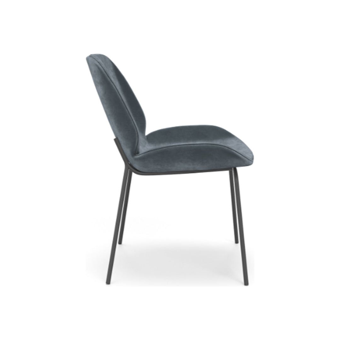 A modern, side-profile view of a sleek King Dining Chair, Smoked Turquoise featuring a plush, dark grey seat and backrest. The chair is supported by four slender, black metal legs, slightly angled to provide stability. The minimalist design highlights clean lines and a contemporary aesthetic with durable upholstery.