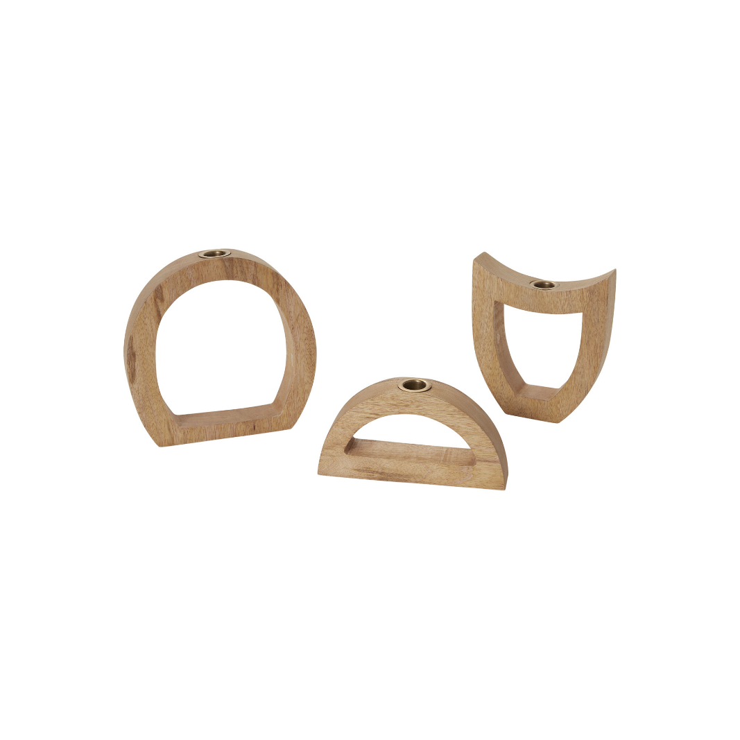 Displayed against a white background are three Wooden Arch Candleholders crafted from rich mango wood: an open circle, a lunar phase arc, and a curved design. Each has a brass metal insert at the top for candles.