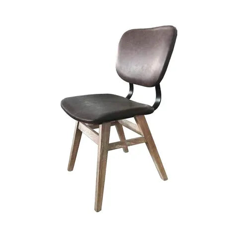 A Brown Leather Dining Chair featuring a dark upholstered cushioned seat and backrest. The chair has a rustic appearance, with four sturdy, light-colored wooden legs set in an angled and supportive design, smoothly blending the brown leather seat and the natural reclaimed wood base. The overall look is modern and functional.