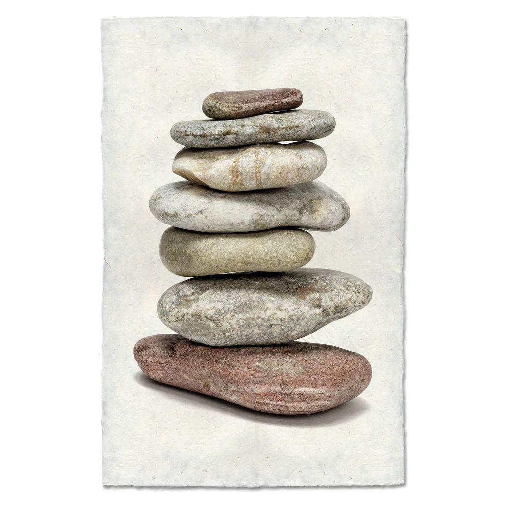Balanced (4) features a stack of seven smooth, flat stones in varying sizes and colors from light gray to brown, arranged largest to smallest, set against textured off-white handmade paper.