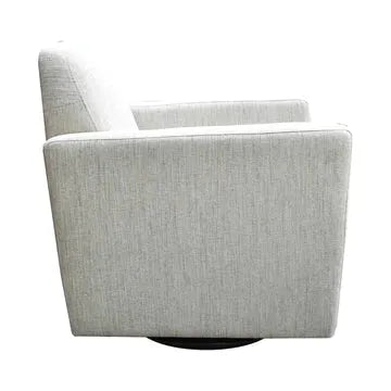 A Cooper Swivel Accent Chair in light gray fabric with a minimalistic design, featuring a boxy shape and a low back. The chair is viewed from the side angle and is set against a white background.