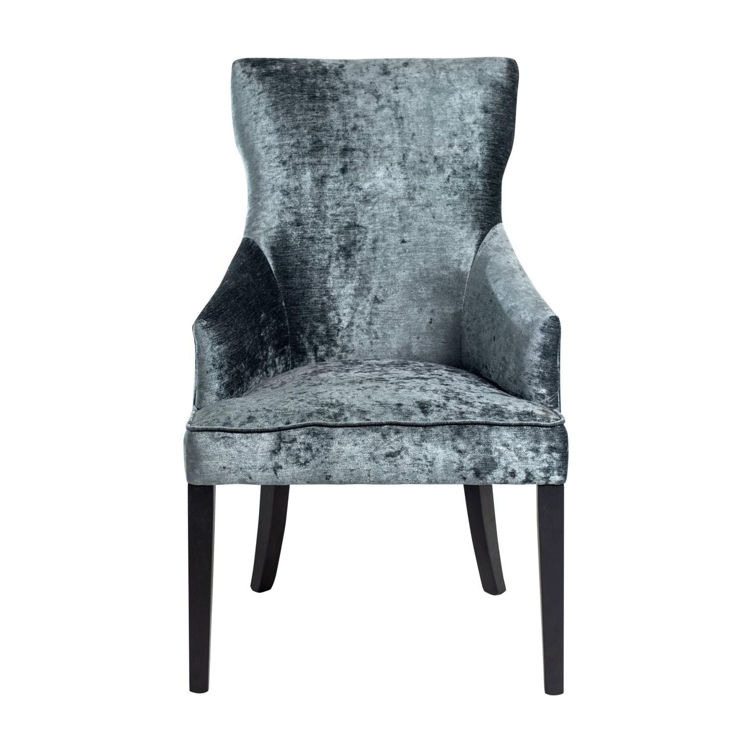 An elegant High Back Dining Chair with a high back and armrests, upholstered in gray crushed velvet, set against a white background. The chair's legs are dark, providing a stark contrast to the light upholstery.
