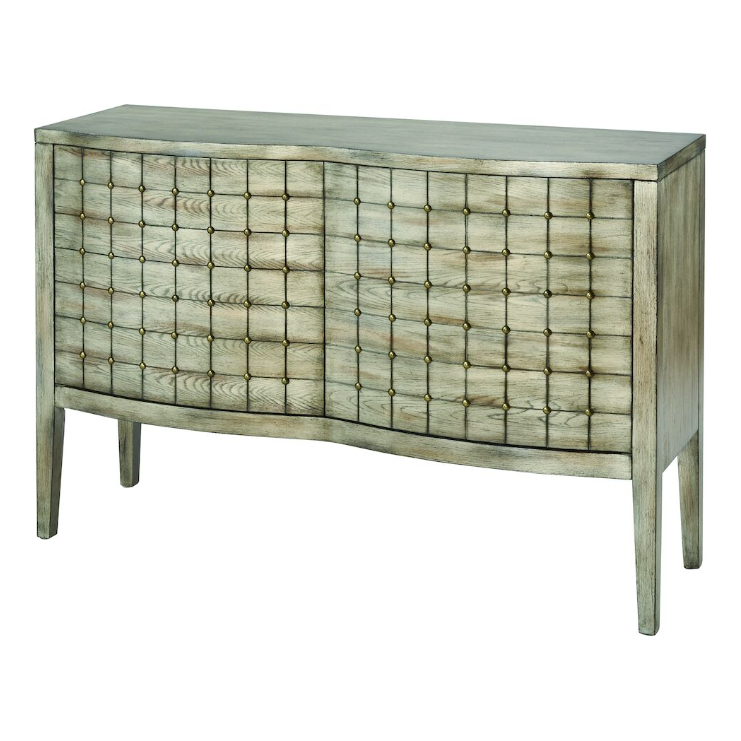 A modern Azalea Cabinet with a distressed finish, featuring a geometrical, textured facade of numerous small square panels and standing on four tapered legs.