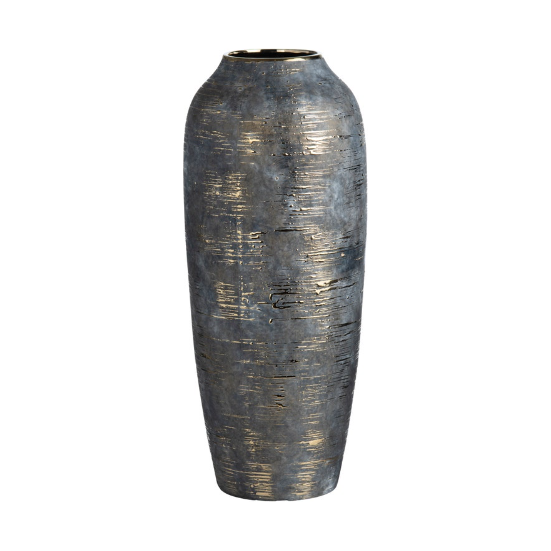 The Triad Vase is a tall, cylindrical ceramic piece with a narrow opening, featuring a metallic, textured surface in dark grey and gold tones for a rustic yet subtly reflective finish.