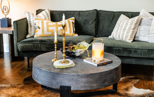 green couch with a stone table