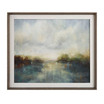 Tranquil Reflections Framed Landscape captures a serene lake beneath a moody sky, with softly blurred trees in brown, green, and gold. Set in an aged walnut frame with a white linen liner, it exudes timeless elegance.