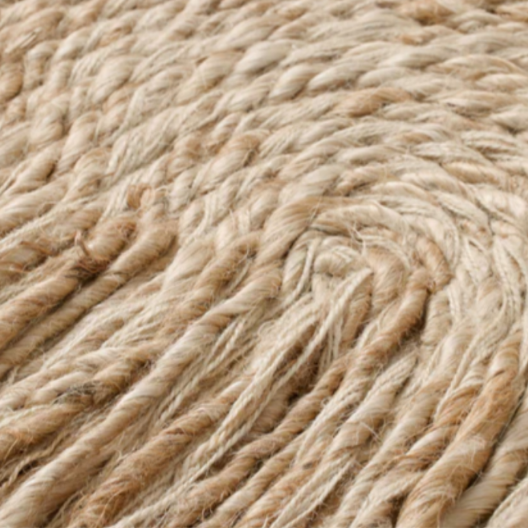 Close-up of the Bellmont Woven Wool Boho Wall Art, showcasing thick woven wool strands in a braided pattern. Its rustic, organic texture and artisanal design echo the charm of handcrafted natural fiber decor.
