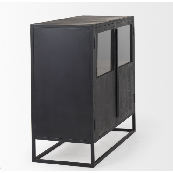 The Obsidian Media Cabinet is a contemporary black metal furniture piece with a rectangular shape and minimalist aesthetic. It showcases dark mango wood doors equipped with precision-crafted long vertical handles. Supported by a sturdy open frame, the cabinet also includes a cable management port for efficient organization.