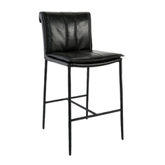 The Calder Leather Counter Stool boasts a sculptural metal frame with sleek slender legs, a simple footrest, cushioned leather upholstery, and a contoured backrest. Its tall black design offers modern comfort with a minimalistic aesthetic.