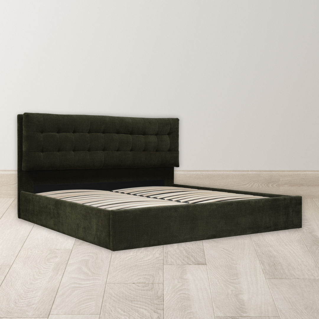 The Corveline Green Storage Bed, featuring a dark upholstered platform and tufted headboard, stands on light wood flooring against a white wall. Wooden slats highlight its modern, minimalist design; mattress not included.