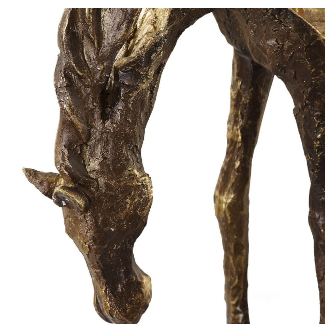 The Eclipse Horse Sculpture, in antiqued bronze, showcases a textured surface against white. The horse's head is lowered gracefully, emphasizing detailed elegance and timeless natural beauty.