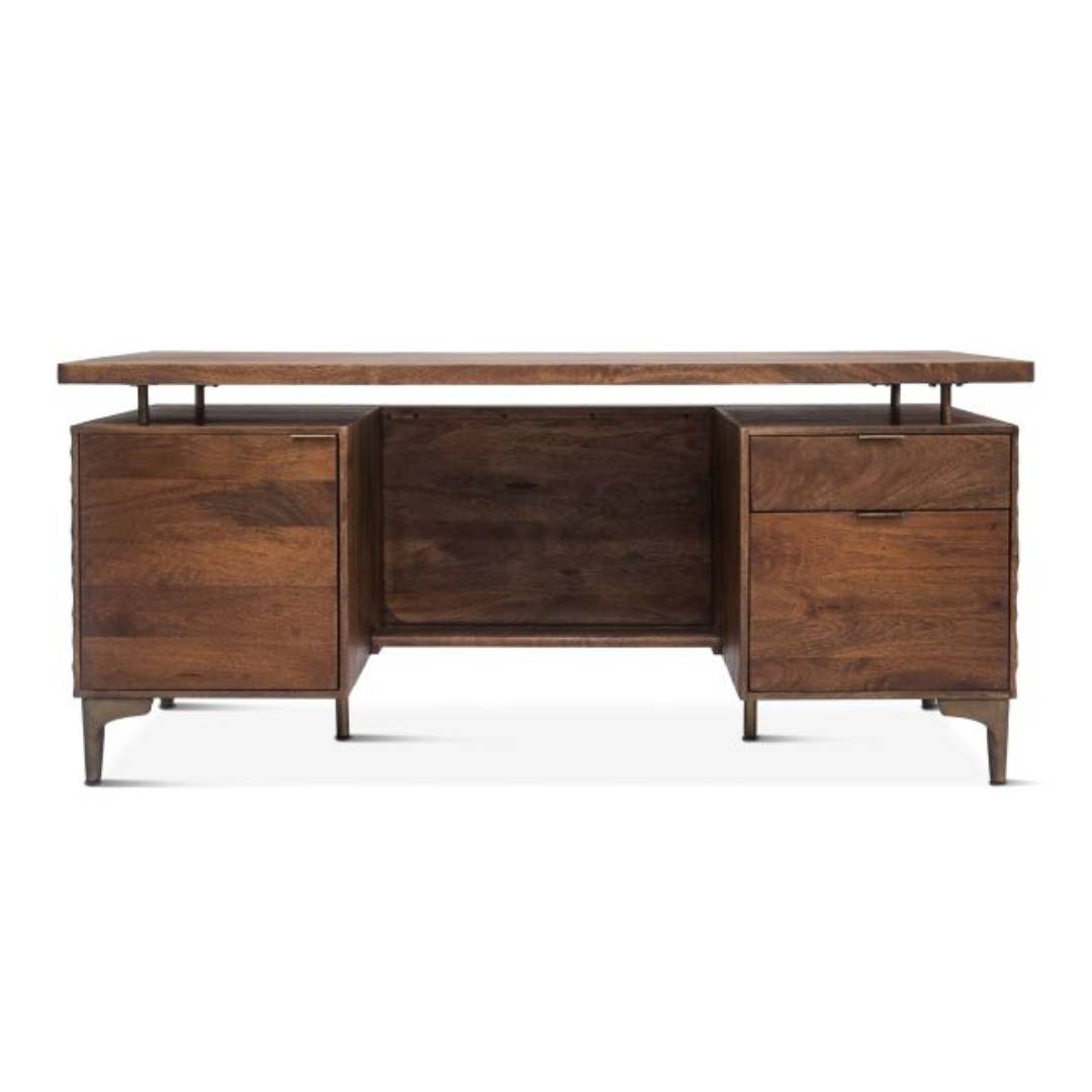 The Cruz Office Desk is a mid-century modern piece made of solid mango wood, featuring a rectangular top, two pedestal bases—one with drawers and one with a cabinet door—and slim metal legs, ideal for contemporary office spaces.