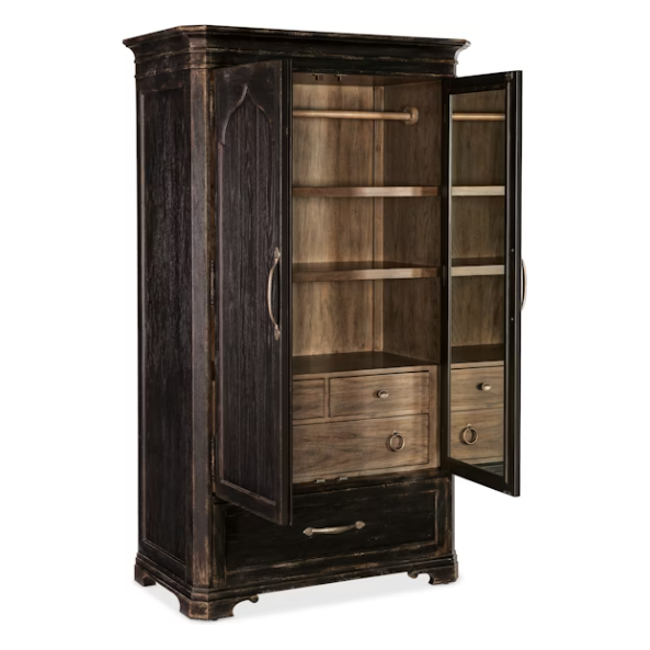 The Florence Wardrobe Cabinet features an aged dark oak veneer exterior with curved edges and brass handles. One open door shows a light wood interior with shelves, drawers, a hanging rod, and a large pull-out drawer below.