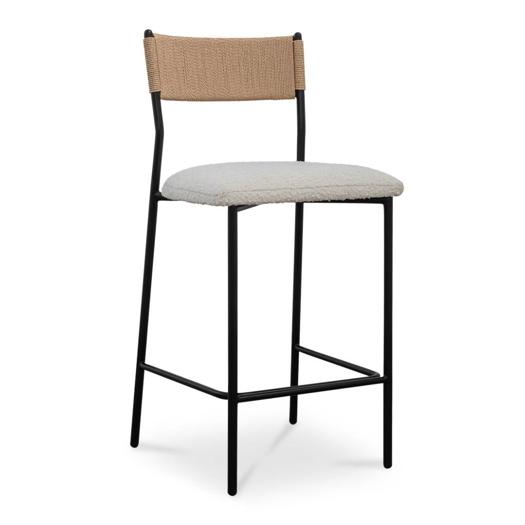 The Soren Performance Fabric Counter Stool features a black metal frame, light beige paper rope backrest, and a light gray cushioned seat with performance fabric. Its slim legs and rectangular footrest create a stylish, contemporary look.