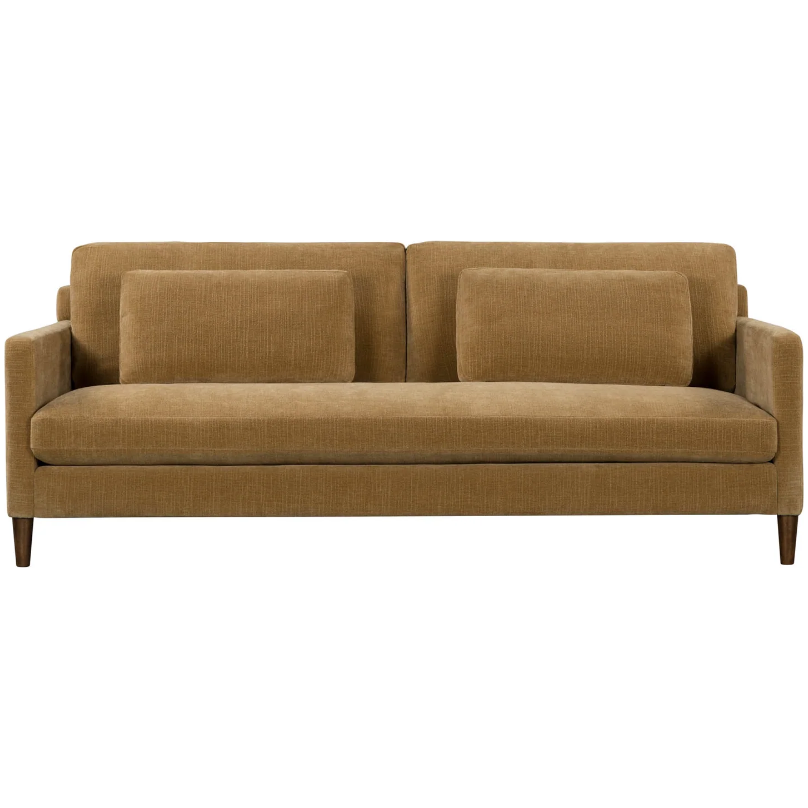 The Gina Mustard Sofa is a mid-century modern piece with plush, textured fabric in a rich mustard hue. Featuring two large seat cushions, matching back and arm cushions, sleek wooden legs, and a tapered design, this distressed velvet beauty brings comfort and style to any room.