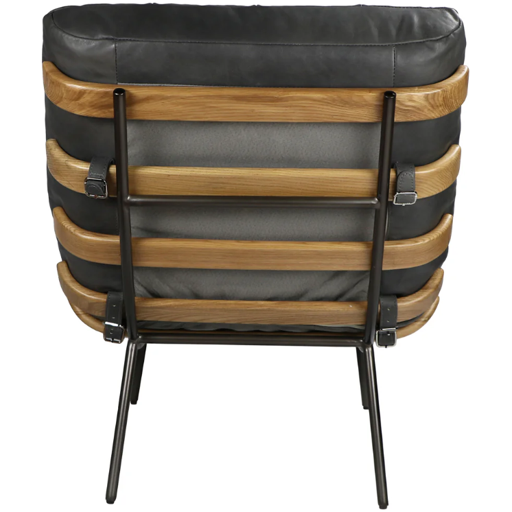 A rear view of the Lance Lounge Accent Chair showcasing its mid-century style, with a sleek black metal frame and wooden slats supporting a cushioned backrest. The chair is upholstered in gray button-tufted leather with visible stitching and supportive buckles, while its thin, straight legs are angled outward.