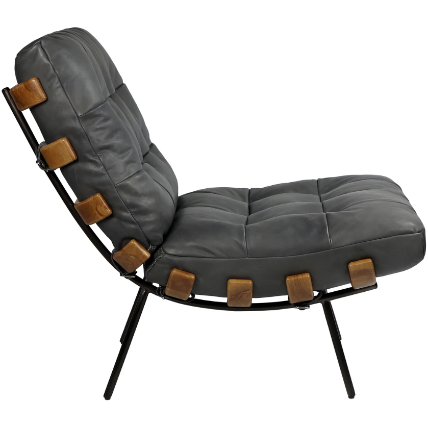 The Lance Lounge Accent Chair is designed with a sleek black metal frame and elegant gray button-tufted leather upholstery. Wooden accent pieces on the sides enrich its mid-century appeal, while four robust black legs ensure sturdy support. This modern chair seamlessly integrates contemporary design with classic elements.
