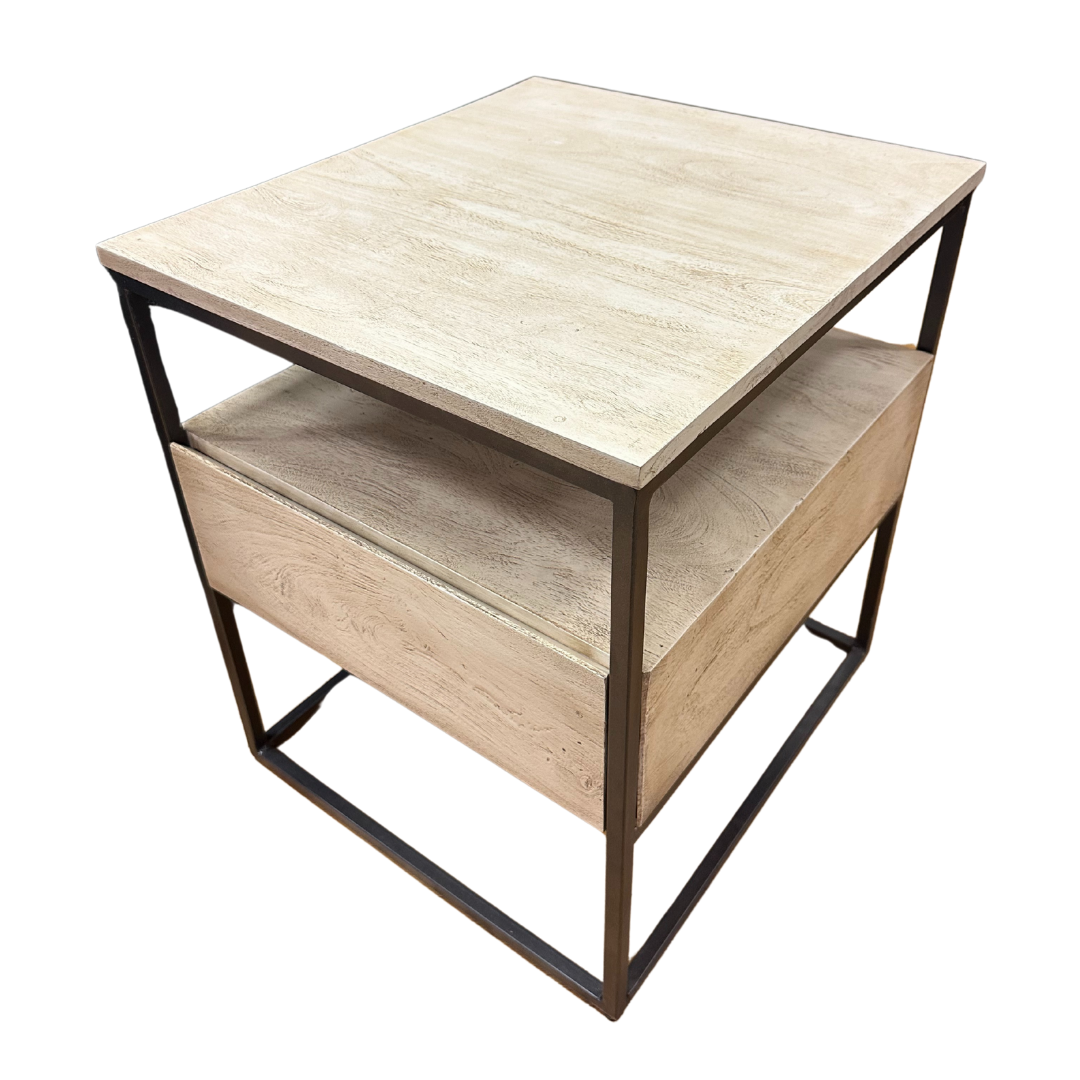 The Halston Side Table blends modern style with natural wood grain, featuring a two-tier design. Its light wood surfaces are framed by black metal for an industrial look, while the rectangular shape and open lower shelf provide functional elegance.