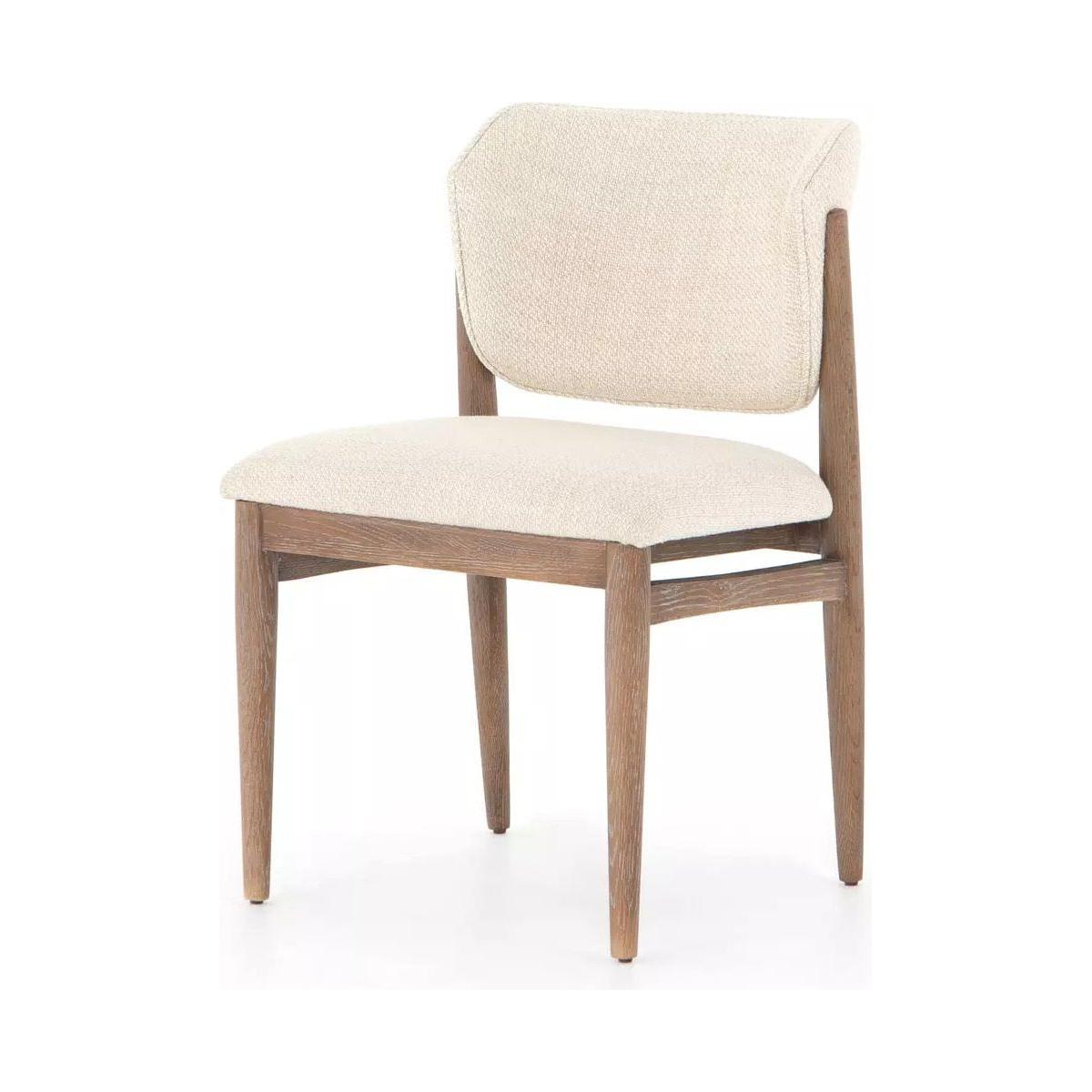 A modern wooden chair with high-performance fabric upholstery in light beige on the seat and backrest, the Joren Dining Chair features a minimalist design with clean lines, tapered legs, and a slightly curved backrest for added comfort. The pecan-finished nettlewood frame complements the fabric beautifully.