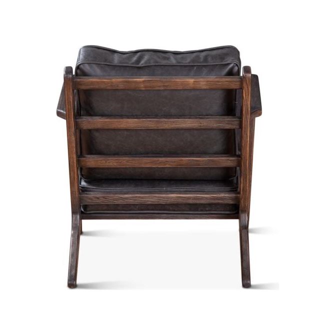 A Dalton Rustic Leather Armchair with a distressed leather cushioned seat and backrest, viewed from the side against a white background. The chair features a rustic design with visible wood grain.