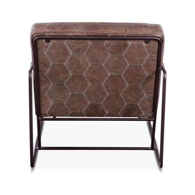 A dusty leather accent chair with a hexagonal pattern embossed on the backrest and seat. The chair has a dark metal frame that is visible and adds an industrial modern touch to its design.