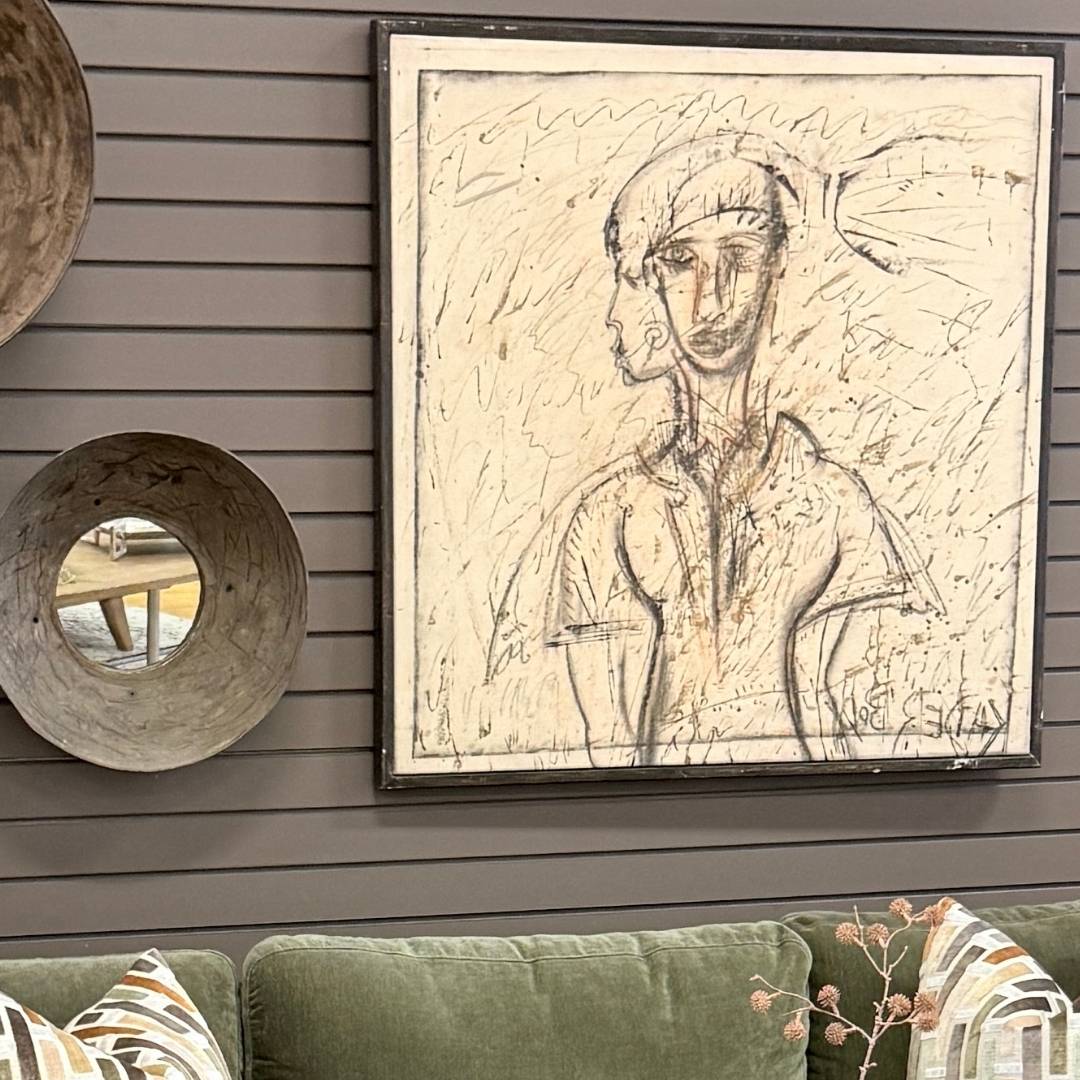 Buy original art by Kader Boly — figurative canvas artwork with a handcrafted black frame mounted on a living room wall.