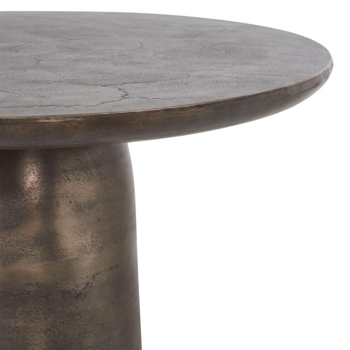 Bronze-colored round table with a textured surface on a white background