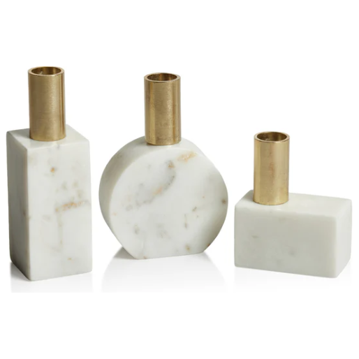 A set of Morphinan Marble Candle Holders, featuring three modern designs with brass tops in rectangular, circular, and square shapes. The white marble bases have subtle gray and beige veining, offering an elegant accent to your home decor with their minimalist design.