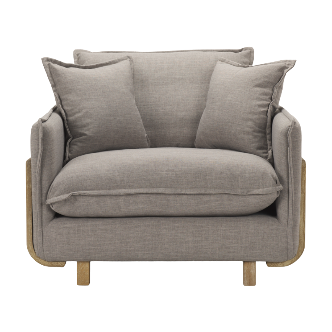 The Veyra Plush Upholstered Armchair in Earthy Grey offers cozy, modern comfort with its large seat cushion, two back cushions, minimalist design featuring light gray fabric upholstery, exposed wooden legs, and open wooden side frame—an elegant statement piece for any room.