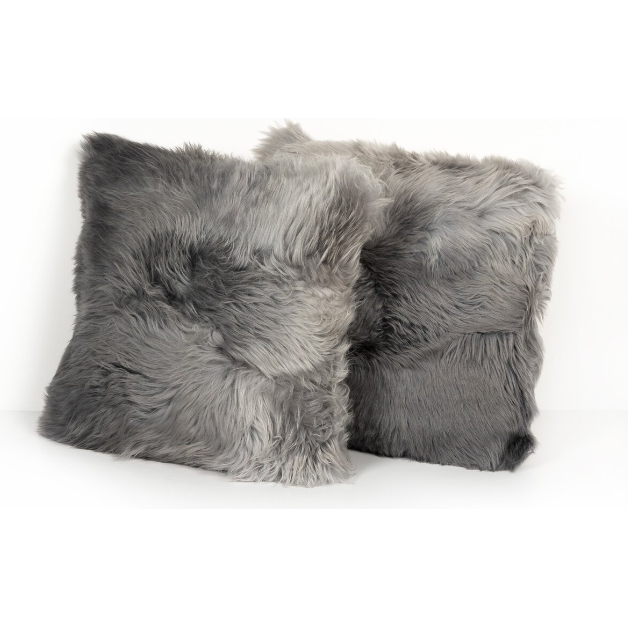 Two plush, square pillows rest side by side against a plain white background. Both Ombre Sheepskin Throw Pillows feature a soft, furry texture with varying shades of gray, creating a cozy and luxurious appearance. The individual fibers catch the light, highlighting the color variations and enhancing the tactile quality of the Ombre Sheepskin Throw Pillow.