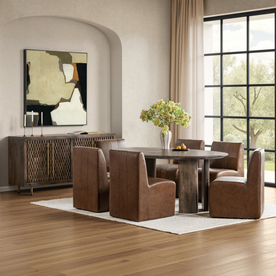 Dining room with brown chairs, round table, and abstract art on the wall.
