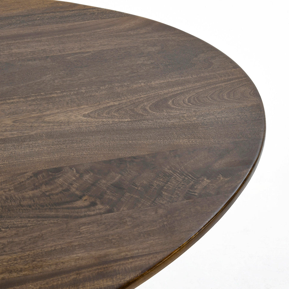 Close-up of a dark wooden round table surface